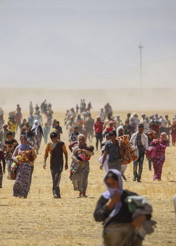 Mosul 2014-08-09MOSUL, IRAQ - AUGUST 9:  Thousands of Yezidis trapped in the Sinjar mountains as they tried to escape from Islamic State (IS) forces, are rescued by Kurdish Peshmerga forces and Peoples Protection Unit (YPG) in Mosul, Iraq on August 09, 2014. (Emrah Yorulmaz - Anadolu Agency)Photo: Emrah Yorulmaz / AA / TT / kod 10611***USA, U.K., CANADA AND FRANCE OUT******BETALBILD***Anadolu Agency/LaPresseOnly Italy