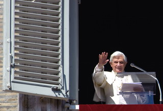 Pope Benedict XVI salutes during his Sunday Angelus prayer from the window of his private apartments overlooking St. Peter's Square at the Vatican on March 8, 2009. The Pontiff said he will visit "the Holy Land" Israel and the Palestinian territories in May to pray for "the unity and peace of the Middle East". AFP PHOTO / ALBERTO PIZZOLI