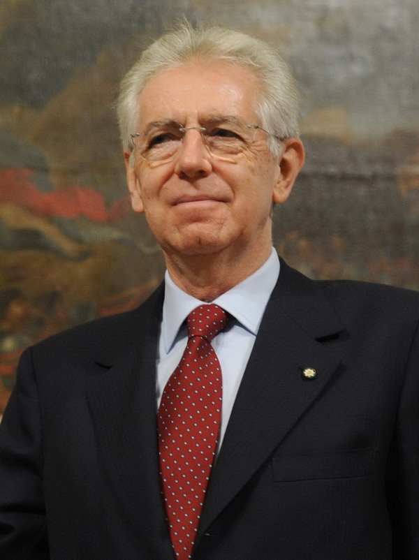 Italian Prime Minister Mario Monti shakes hands with European Council President Herman Van Rompuy  after  press conference on 16 January , 2012 at Palazzo Chigi in Rome. AFP PHOTO/ Tiziana Fabi
