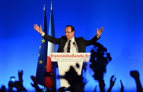 Socialist party (PS) newly elected president Francois Hollande waves as he arrives on stage to give a speech after the results of the second round of the presidential election on May 6, 2012 in Tulle, southwestern France. Francois Hollande was elected France's first Socialist president in nearly two decades today, dealing a humiliating defeat to incumbent Nicolas Sarkozy and shaking up European politics.   AFP PHOTO / PHILIPPE DESMAZES