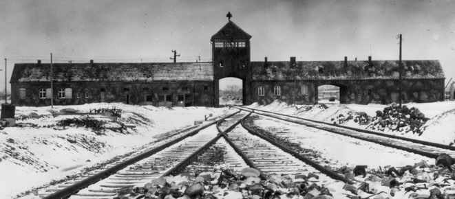 An undated archive photograph shows Auschwitz II-Birkenau main guard house which prisoners called "the gate of death".  An undated archive photograph shows Auschwitz II-Birkenau's main guard house which prisoners called "the gate of death" and the railway with the remains of abandoned crockery. The railway, which was built in 1944, was the last stop for the trains bringing Jews to the death camp. REUTERS/HO-AUSCHWITZ MUSEUM