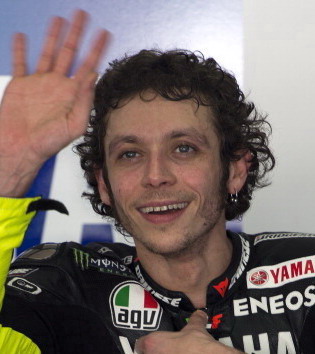 Yamaha MotoGP rider Valentino Rossi of Italy waves to his fans while getting ready for a ride on the first day of the pre-season motorcyling test at the Sepang circuit outside Kuala Lumpur on February 5, 2013. AFP PHOTO / Saeed Khan        (Photo credit should read SAEED KHAN/AFP/Getty Images)