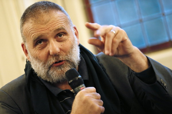 Italian priest Paolo Dall’Oglio, expelled from Syria by Bashar al-Assad’s government in June takes part in a conference on the theme "Syrian christians" , on September 25, 2012 in Paris. After 30 years of running a monastery near Damascus, Dall’Oglio has reinvented himself since his departure as an unofficial diplomat for Assad's opponents, trying to create a united opposition. AFP PHOTO KENZO TRIBOUILLARD
